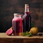 Artistic composition featuring a bottle of kombucha and a bottle of freshly pressed beet juice arranged on a wooden surface, highlighting complementary aspects of both beverages in a weight loss context.